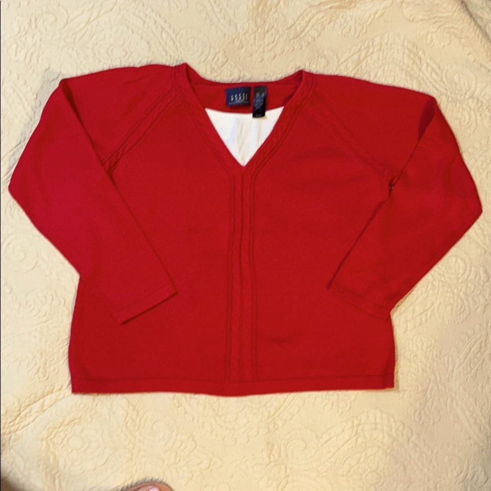 Red sweater w white V-neck  insert detail